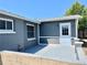 Private back patio with gray painted walls and concrete flooring at 3615 Wellington Dr, Holiday, FL 34691