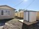 Backyard with storage shed and wooden fence at 3615 Wellington Dr, Holiday, FL 34691