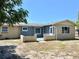 Rear view of house with patio and partial fence visible at 3615 Wellington Dr, Holiday, FL 34691