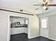 Open kitchen with white cabinets and tile flooring at 3615 Wellington Dr, Holiday, FL 34691