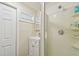 Bathroom with shower, sink, and built-in shelving at 1508 Delaware Ne Ave, St Petersburg, FL 33703