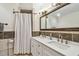 Bathroom boasts double vanity and shower at 1508 Delaware Ne Ave, St Petersburg, FL 33703