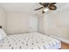 Bedroom with double bed, ceiling fan, and ample closet space at 1508 Delaware Ne Ave, St Petersburg, FL 33703