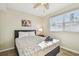 Bedroom with a ceiling fan and large window at 1508 Delaware Ne Ave, St Petersburg, FL 33703