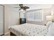 Bedroom with double bed, ceiling fan, and dresser at 1508 Delaware Ne Ave, St Petersburg, FL 33703