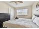 Well-lit bedroom with a comfy bed and dresser at 1508 Delaware Ne Ave, St Petersburg, FL 33703