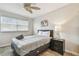 Bedroom with ceiling fan, dresser and window at 1508 Delaware Ne Ave, St Petersburg, FL 33703