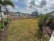 Landscaped backyard with grassy area at 1574 Running Tide Pl, Sarasota, FL 34240