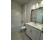 Clean bathroom with white vanity, tub and shower at 1574 Running Tide Pl, Sarasota, FL 34240