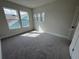 Spacious bedroom with two windows and carpeted floors at 1574 Running Tide Pl, Sarasota, FL 34240