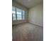 Bright bedroom with carpet and a large window overlooking the water at 1574 Running Tide Pl, Sarasota, FL 34240