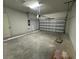 Attached garage with overhead door and ample space at 1574 Running Tide Pl, Sarasota, FL 34240