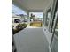 Covered porch with view of the backyard at 1574 Running Tide Pl, Sarasota, FL 34240