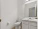 Clean and simple bathroom with white vanity and toilet at 12814 Cattail Shore Ln, Riverview, FL 33579