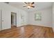 Spacious bedroom with wood-look flooring and backyard access at 12814 Cattail Shore Ln, Riverview, FL 33579