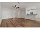 Living room with hardwood floors and a view to the kitchen at 12814 Cattail Shore Ln, Riverview, FL 33579