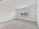 Simple bedroom with gray carpet and a window with blinds at 9305 Barnacle Ln, Parrish, FL 34219