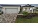 Home exterior with landscaped yard at 9305 Barnacle Ln, Parrish, FL 34219