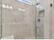 Modern shower with glass enclosure and gray tile at 9305 Barnacle Ln, Parrish, FL 34219