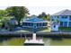 Aerial view of the house, dock, and surrounding canal at 4483 Flounder Dr, Hernando Beach, FL 34607