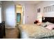 Bedroom featuring an ensuite bathroom and wood-look flooring at 3639 Hurston St, New Port Richey, FL 34655