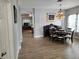 Inviting dining area with hardwood floors and a view into the living room at 3639 Hurston St, New Port Richey, FL 34655