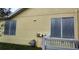 House exterior showcasing storm shutters and gas meter at 3639 Hurston St, New Port Richey, FL 34655