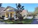Inviting home with a covered front porch, mature landscaping, and manicured lawn at 3639 Hurston St, New Port Richey, FL 34655