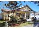 Charming yellow home with a cozy front porch and well-manicured lawn at 3639 Hurston St, New Port Richey, FL 34655