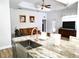 Open-concept kitchen with a granite island, a stainless steel sink, and copper colored plumbing fixtures at 3639 Hurston St, New Port Richey, FL 34655