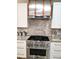 Stylish kitchen with stainless steel appliances and granite countertops at 3639 Hurston St, New Port Richey, FL 34655