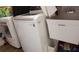 Modern laundry room with a washing machine, a dryer, and a wash tub at 3639 Hurston St, New Port Richey, FL 34655