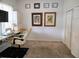 Well lit office with a large desk area, carpeted floor, a ceiling fan and closet at 3639 Hurston St, New Port Richey, FL 34655