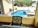 Inviting pool area with screened enclosure, offering a relaxing outdoor space at 3639 Hurston St, New Port Richey, FL 34655