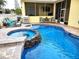 Relaxing pool and spa with patio furniture at 3639 Hurston St, New Port Richey, FL 34655