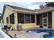 Private backyard oasis featuring a sparkling pool and spacious patio at 3639 Hurston St, New Port Richey, FL 34655