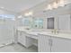 Elegant bathroom with double vanity, large mirror, and walk-in shower at 1526 5Th S St, St Petersburg, FL 33701