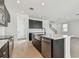 Modern kitchen with stainless steel appliances and an island at 1526 5Th S St, St Petersburg, FL 33701