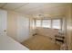 Cozy bedroom with light brown carpet, dresser, and window coverings at 116 W Saint Johns Way, Apollo Beach, FL 33572
