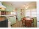 Bright kitchen features light green cabinets, and a built-in corner hutch at 116 W Saint Johns Way, Apollo Beach, FL 33572