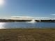 Scenic community lake with a water fountain at 10225 Kalamazoo Pl, Parrish, FL 34219