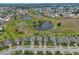 Community overview with home and lake at 1817 Pacific Dunes Dr, Sun City Center, FL 33573