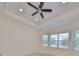 Bright bedroom with ceiling fan and bay window at 1817 Pacific Dunes Dr, Sun City Center, FL 33573