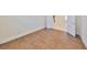 Room with wood-look tile flooring and open doors at 1817 Pacific Dunes Dr, Sun City Center, FL 33573