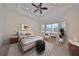 Main bedroom with a king-size bed and bay window at 1817 Pacific Dunes Dr, Sun City Center, FL 33573