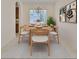 Inviting dining room showcasing a wood table, neutral chairs, and stylish botanical wall art at 1817 Pacific Dunes Dr, Sun City Center, FL 33573