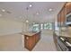 Kitchen island with granite countertops and stainless steel appliances at 1817 Pacific Dunes Dr, Sun City Center, FL 33573