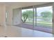 Sliding glass doors that open to a patio with water views at 1817 Pacific Dunes Dr, Sun City Center, FL 33573