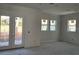 Bright bedroom with french doors leading to backyard at 3707 W San Juan St, Tampa, FL 33629