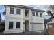 Modern two-story home featuring a symmetrical facade and integrated two-car garage at 3707 W San Juan St, Tampa, FL 33629